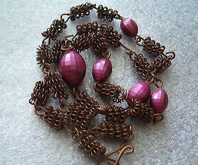 Vintage wrapped copper wire with faceted purple plastic beads