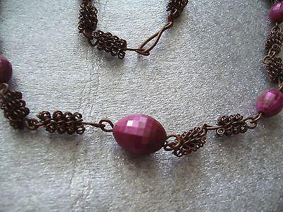 Vintage wrapped copper wire with faceted purple plastic beads