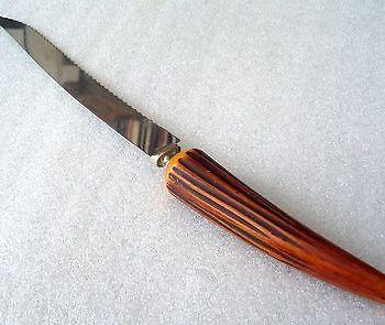 Vintage mid century bread knife with bakelite handle horn imitation