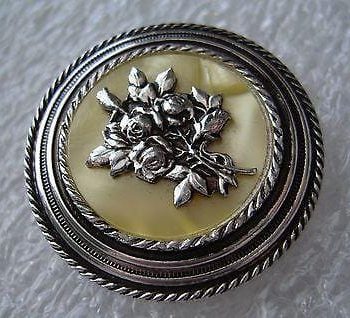Vintage mother of pearl or celluloid and silver tone flower scarf clip