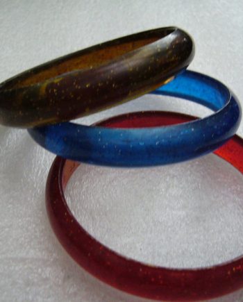 Vintage plastic red blue and brown bangles with Israeli label