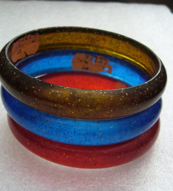 Vintage plastic red blue and brown bangles with Israeli label